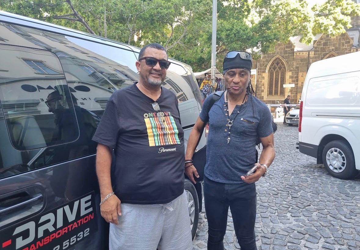 Harry Juries with a client on a Cape Town street